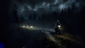 Wallpaper Riders explore a dim trail on dirt bikes during an exciting nighttime adventure relying solely on their headlights to guide them