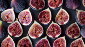Fresh figs meticulously arranged in a symmetrical design lending an elegant vibe to your wallpaper