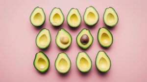 Symmetrically arranged avocado halves create an aesthetically pleasing pattern in a wallpaper titled avocado halves arranged.jpg