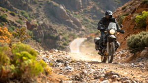 A daring trailblazer on a rugged adventure bike ventures through challenging terrain with expert precision and unwavering resolve