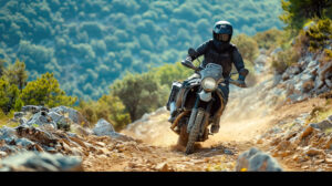 A rugged adventure bike conquering rugged terrain, its rider navigating rocky trails with skill and determination