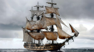 A grand tall ship with majestic billowing sails evoking memories of a past age of discovery and adventure on the open ocean