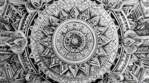 A mesmerizing wallpaper displaying an elaborate mandala doodle featuring intricate geometric patterns and ornate details that captivate the viewer