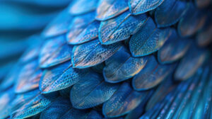 Get immersed in the mesmerizing world of marine life with this wallpaper capturing the intricate details of a blue fishs scales and fins