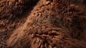 A close up texture of soft, fluffy fur in rich brown tones, highlighting the intricate patterns and warmth