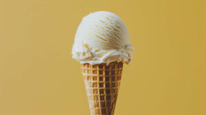 A wallpaper showcasing a minimalist design a scoop of ice cream in a waffle cone against a clean simple background in the JPEG format