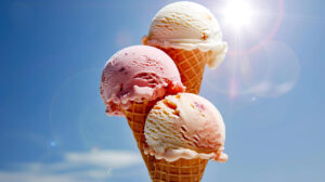 An iconic ice cream cone boasting three unique scoops of flavors delicately melting in the warm embrace of a vivid summer sun